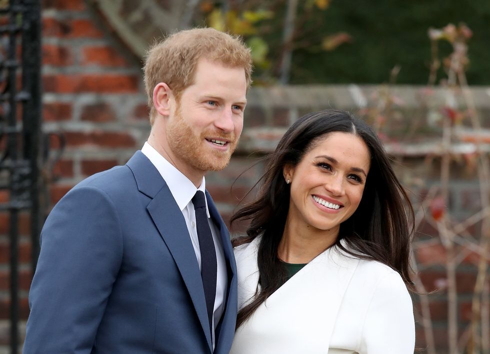 Prince Harry and actress Meghan Markle during an official photocall to announce their engagement at The Sunken Gardens at Kensington Palace