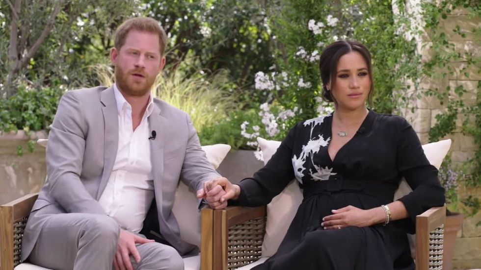Prince Harry and Meghan being interviewed by Oprah Winfrey