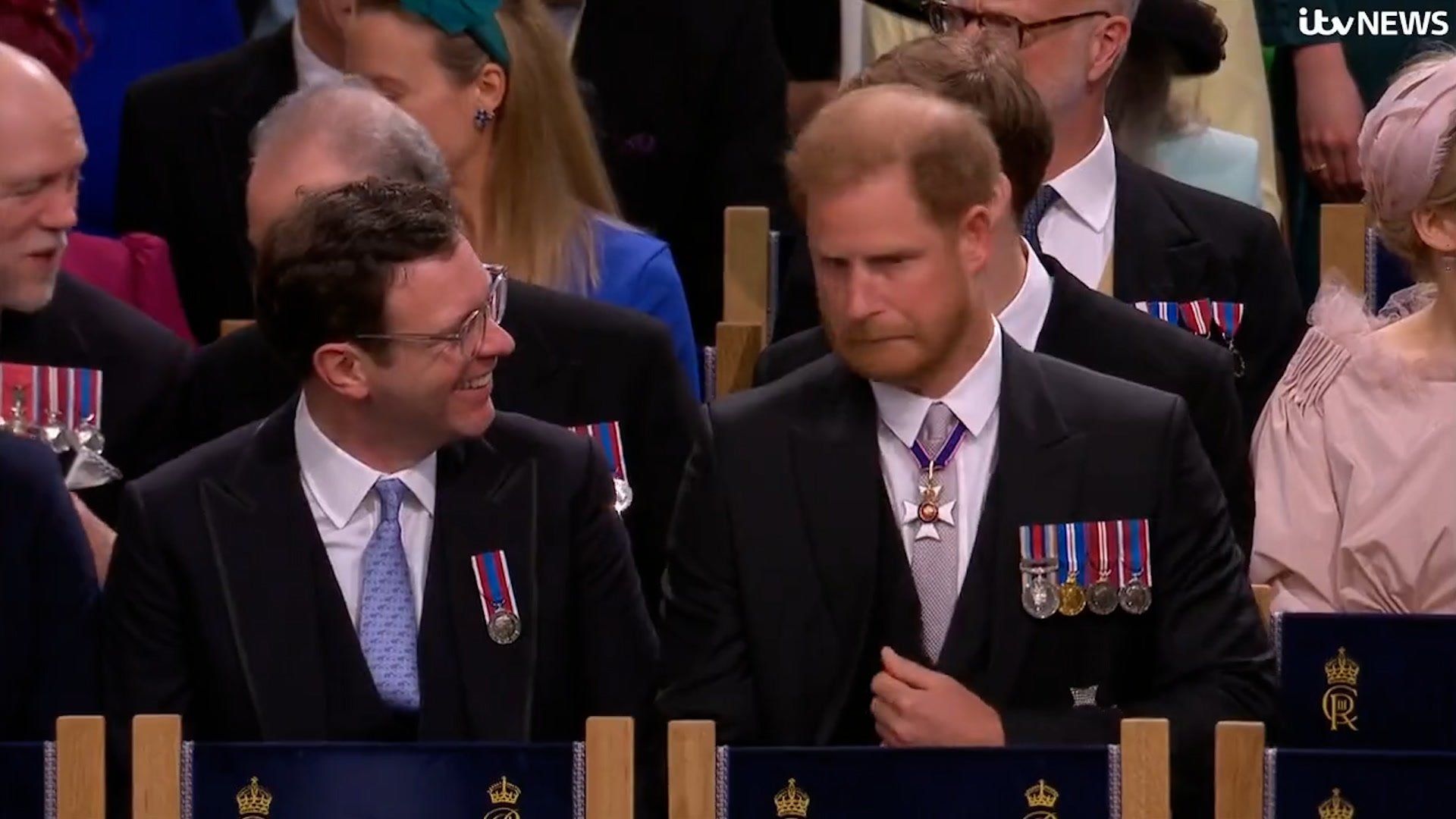 Prince Harry's view of the coronation blocked by his aunt's feathers as