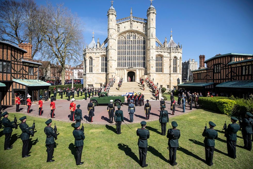 Prince Philip, Duke of Edinburgh\u2019s coffin, covered with His Royal Highness\u2019s Personal Standard arrives by Landrover Defender at St George\u2019s Chapel carried by a bearer party found by the Royal Marines during the funeral of Prince Philip, Duke of Edinburgh at Windsor Castle