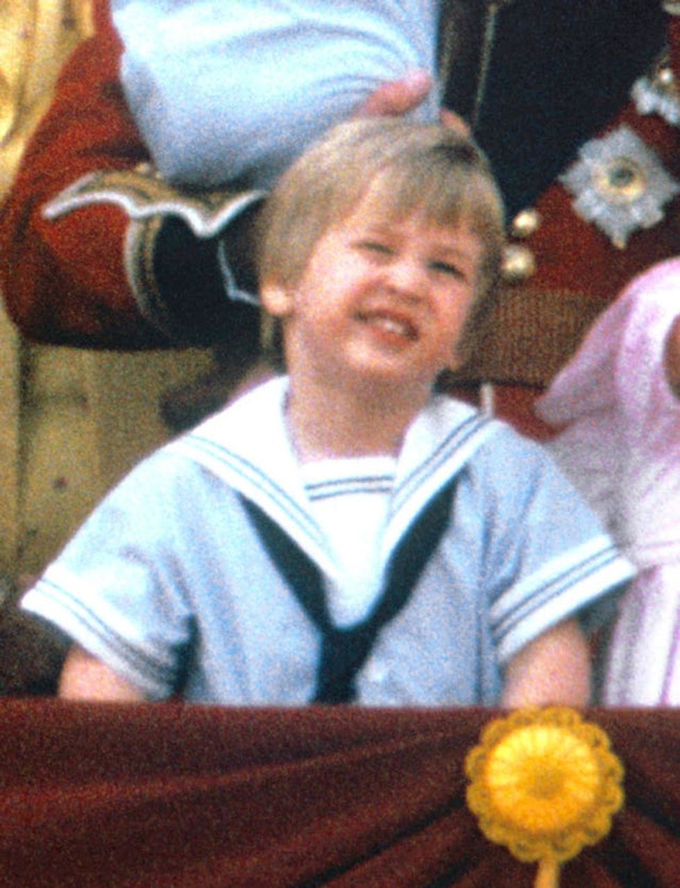 Prince William, now the Duke of Cambridge, on the balcony of Buckingham Palace, London, to watch the fly past, following Trooping the Colour. Prince Louis is today wearing a similar outfit to his father\u2019s from 1985