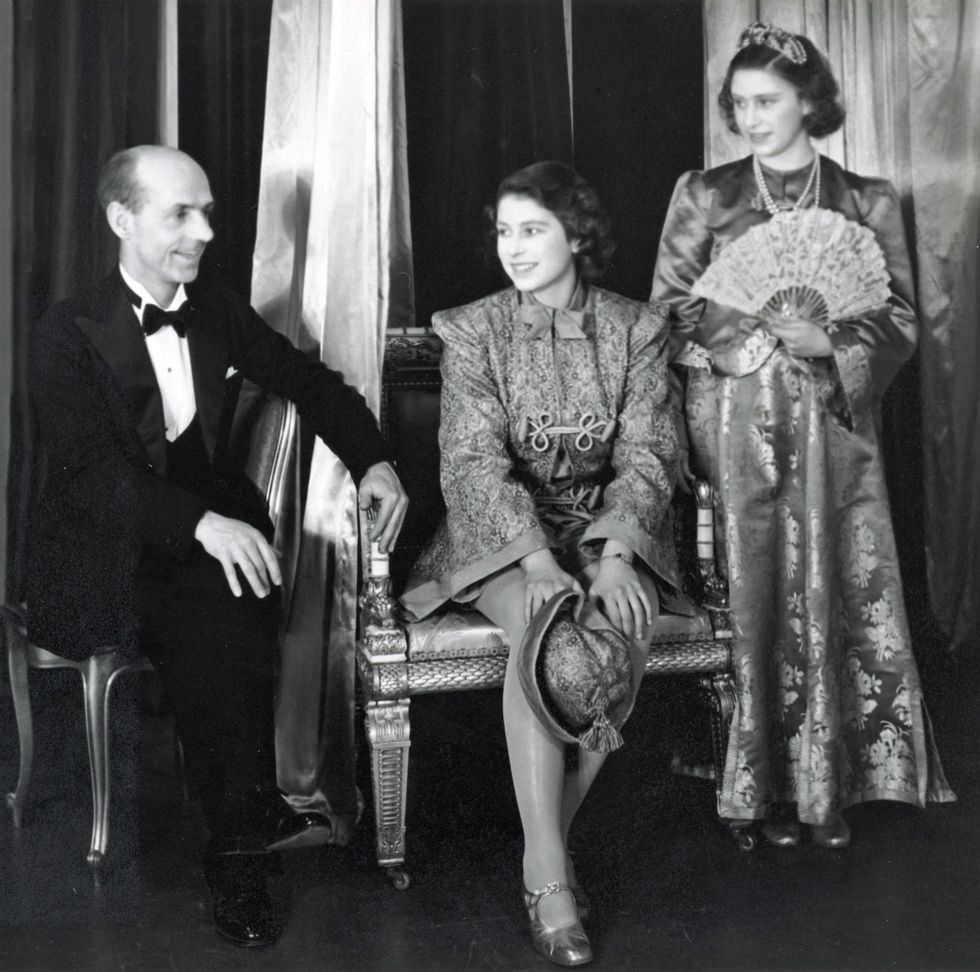 Princess Elizabeth and Princess Margaret, dressed in costumes for the 1943 performance of Aladdin, with headmaster Hubert Tanner (Royal Collection/Queen Elizabeth II 2021/PA)