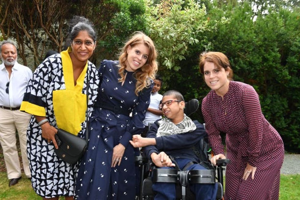 Princesses Beatrice and Eugenie with Sheema Luca and her son Massimo Luca during a garden party at Haven House Children\u2019s Hospice, Woodford Green