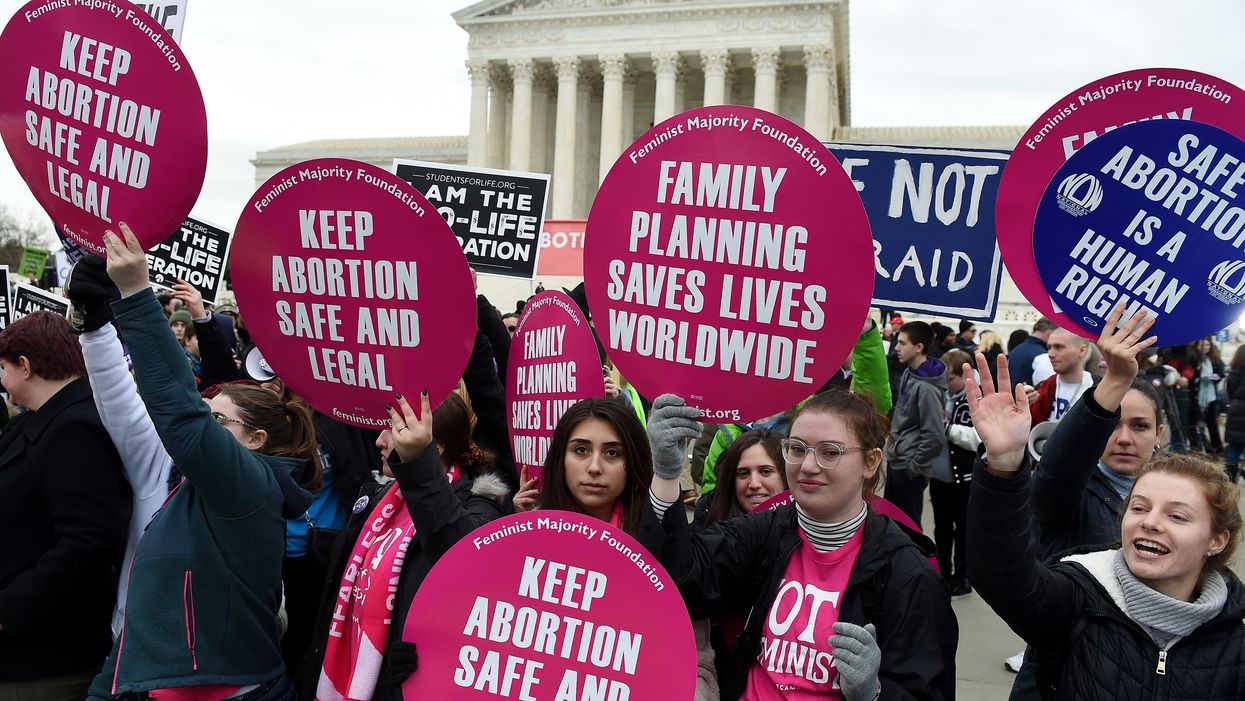 Pro-choice and pro-life activists demonstrate in front of the the US Supreme Court