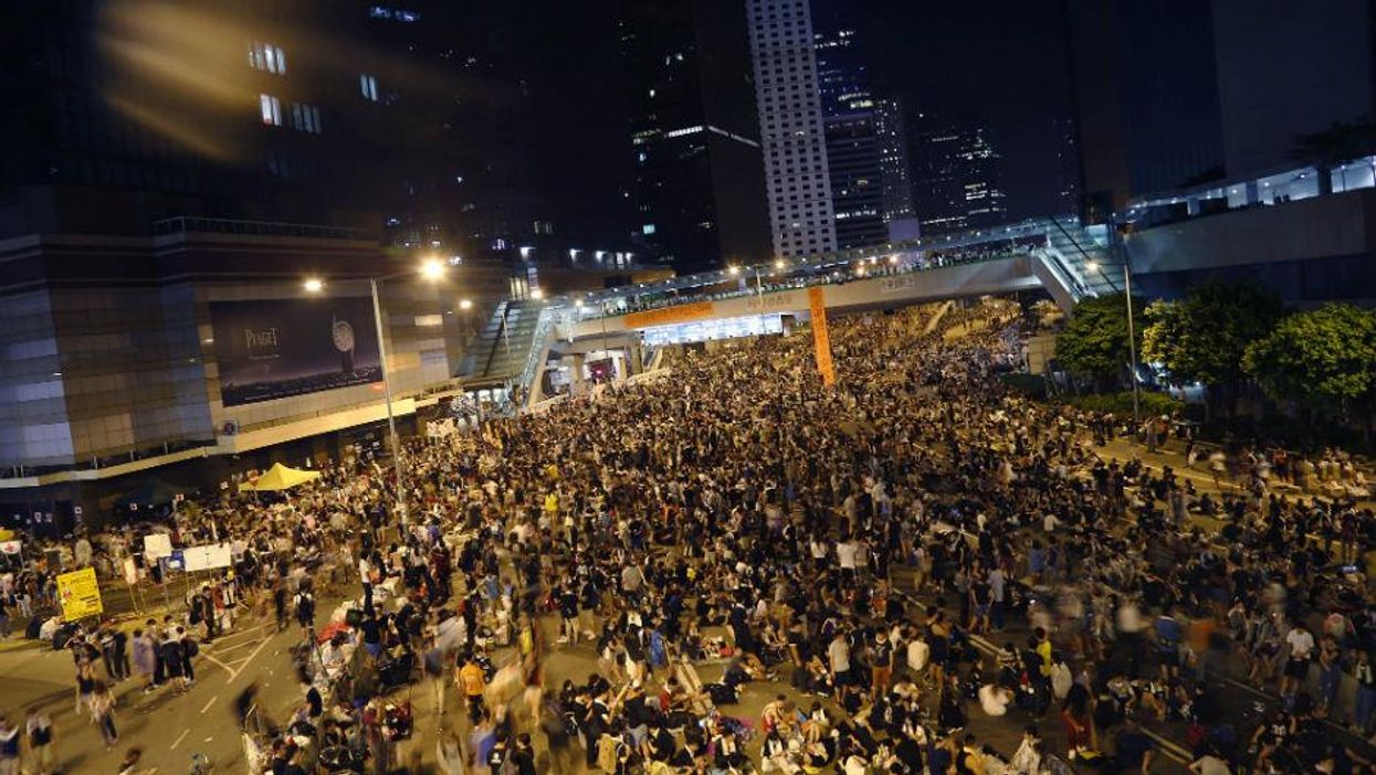 Pro-democracy protesters gather in the early hours of the morning