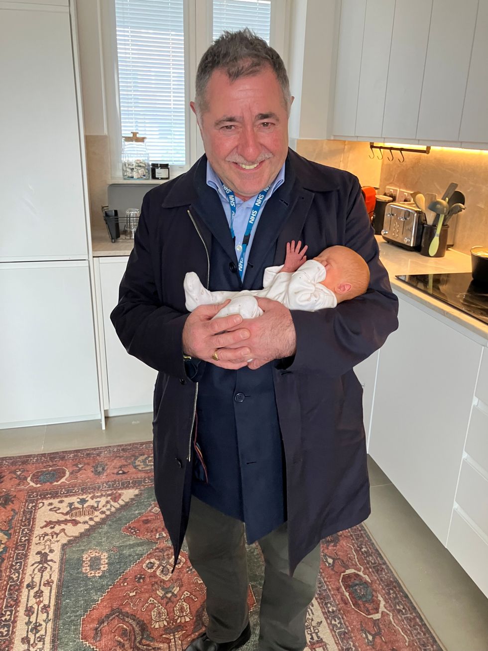 Professor Richard Smith holding Amy