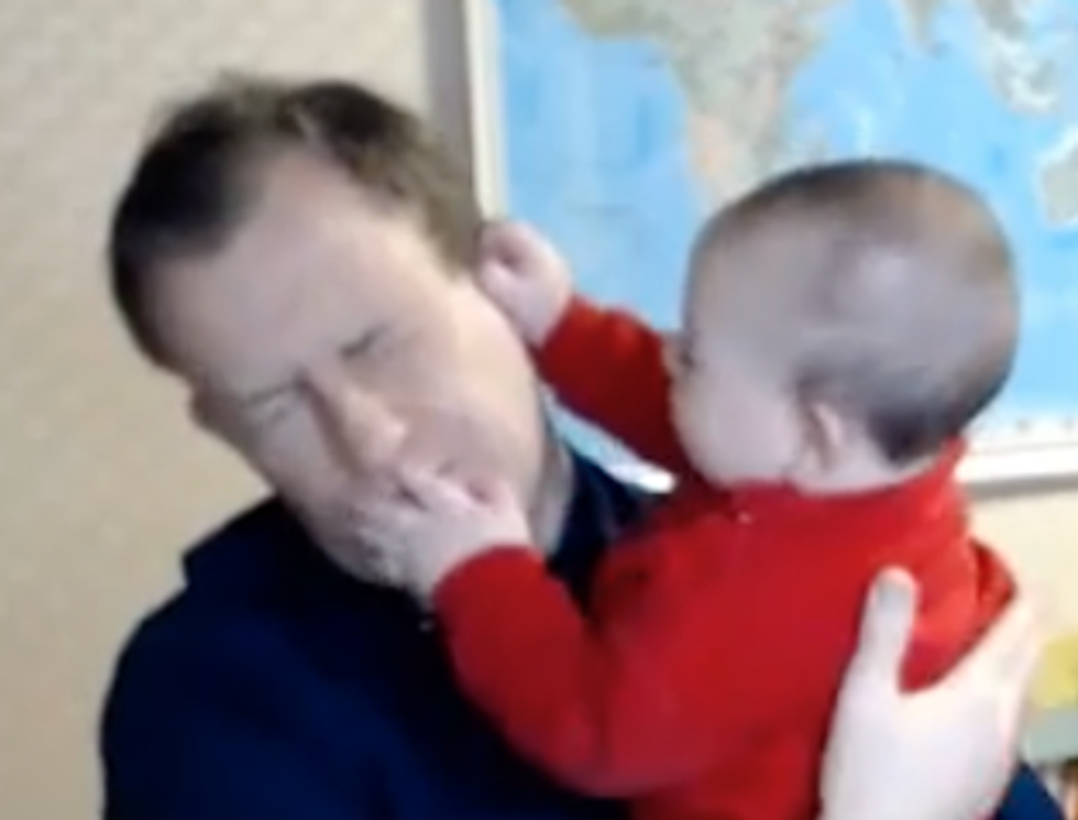 Professor Robert Kelly with his nine-month-old son James