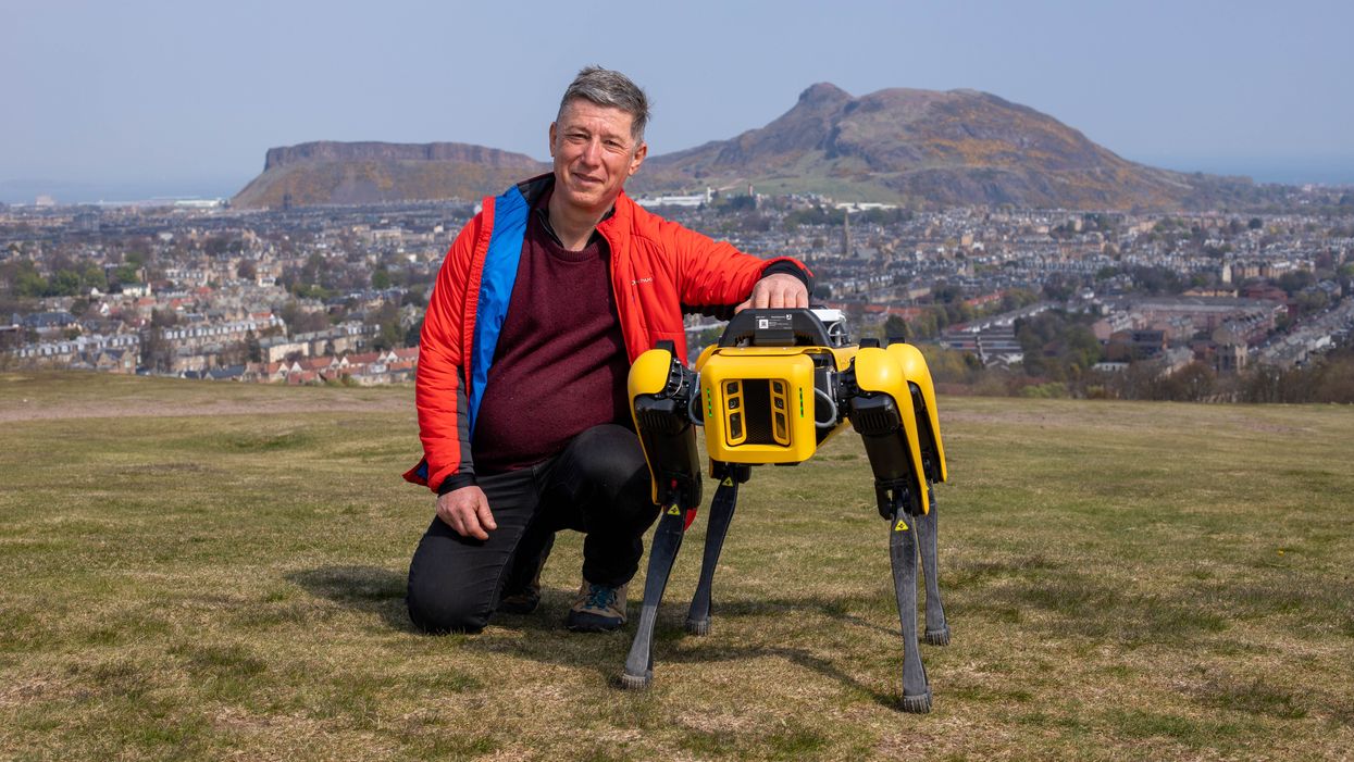 Professor Yvan Petillot with the robot