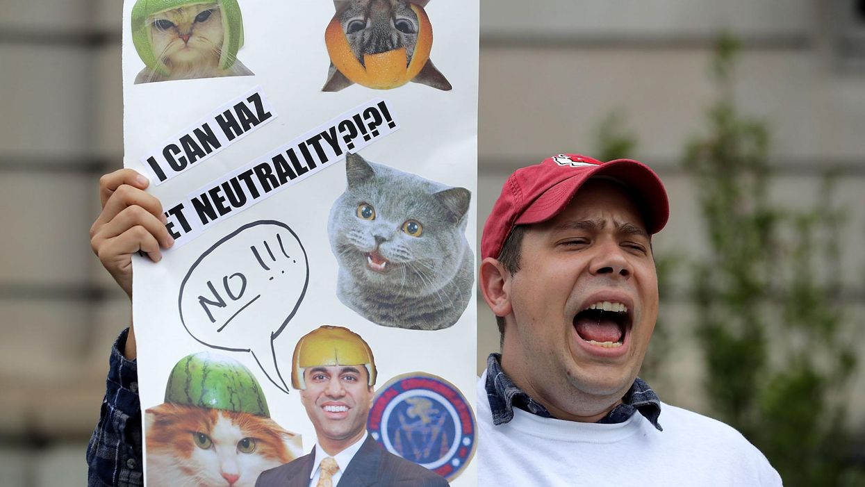 Proponents of net neutrality protest against Federal Communication Commission Chairman Ajit Pai outside the American Enterprise Institute before his arrival May 5, 2017 in Washington, DC