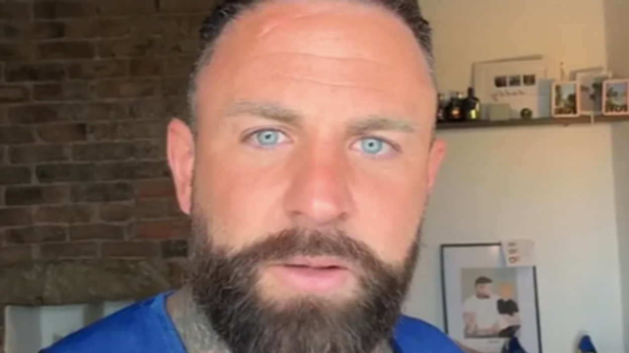 Dad hits out at trolls after being shamed for kissing his son