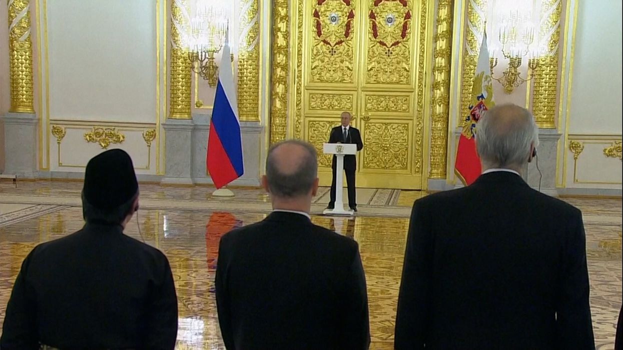 Putin reaches peak paranoia by standing a cricket pitch away from crowd