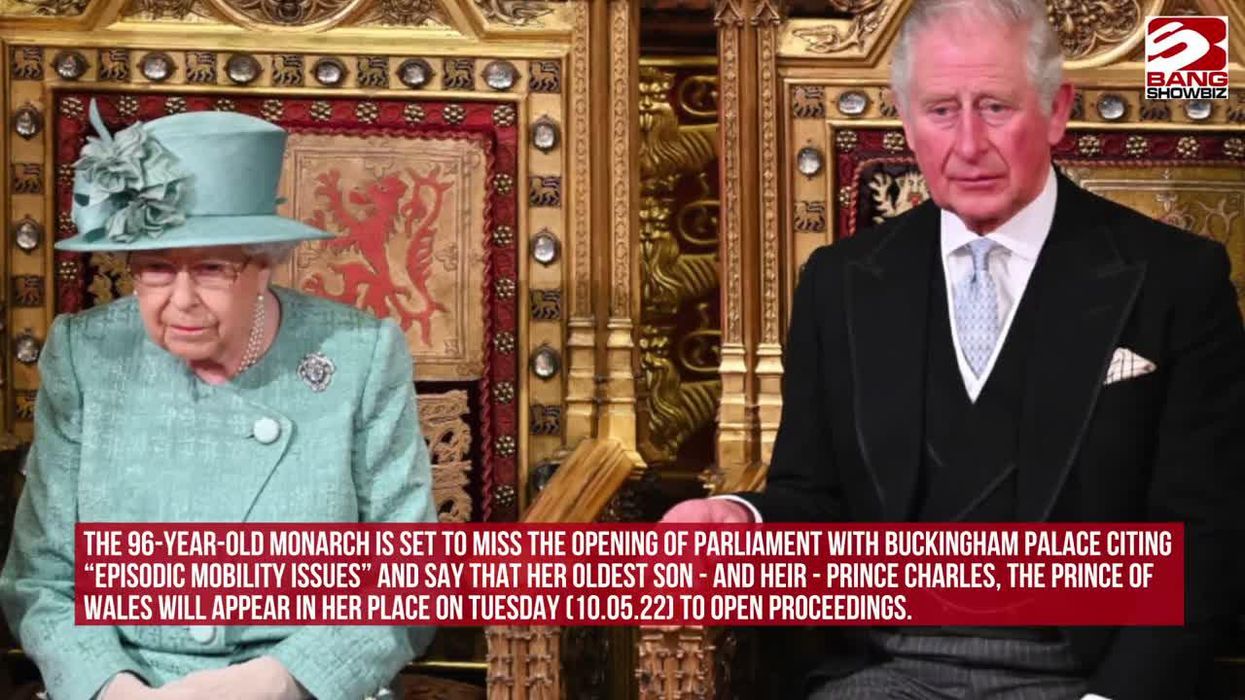 Queen and Prince Charles sit on gold thrones in the House of Lords.