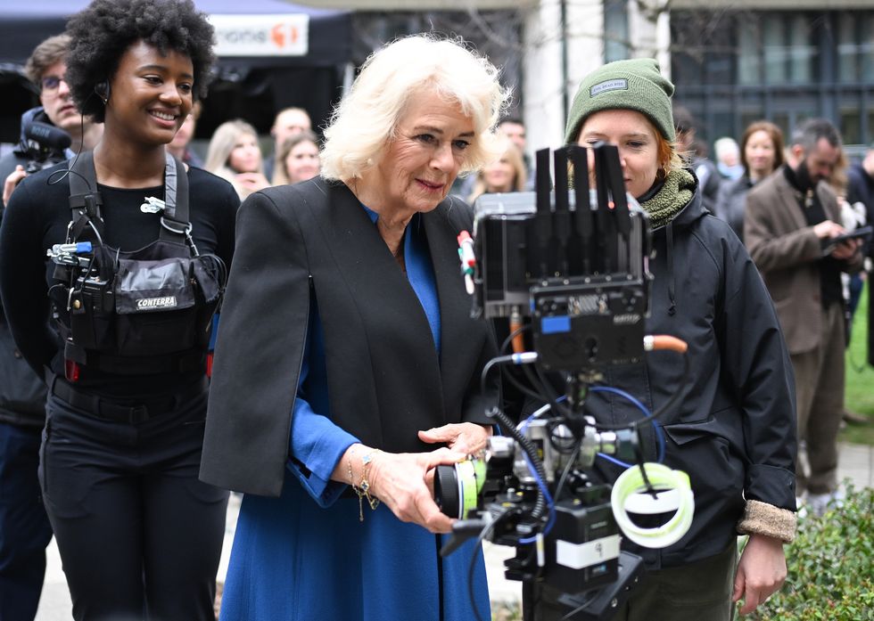 Queen tries her hand as camera assistant on crime drama as ITV marks anniversary