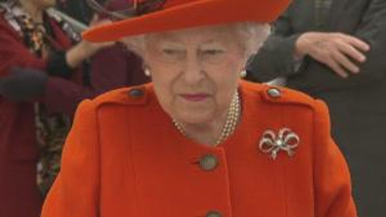 German waxwork of The Queen is bald underneath hat to avoid extra upkeep costs