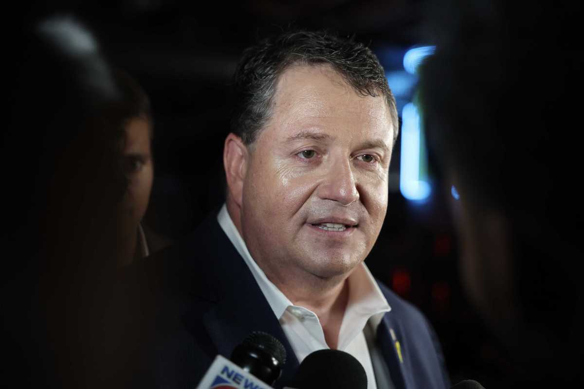 Randy Fine, a white man with short black hair, speaking to reporters.