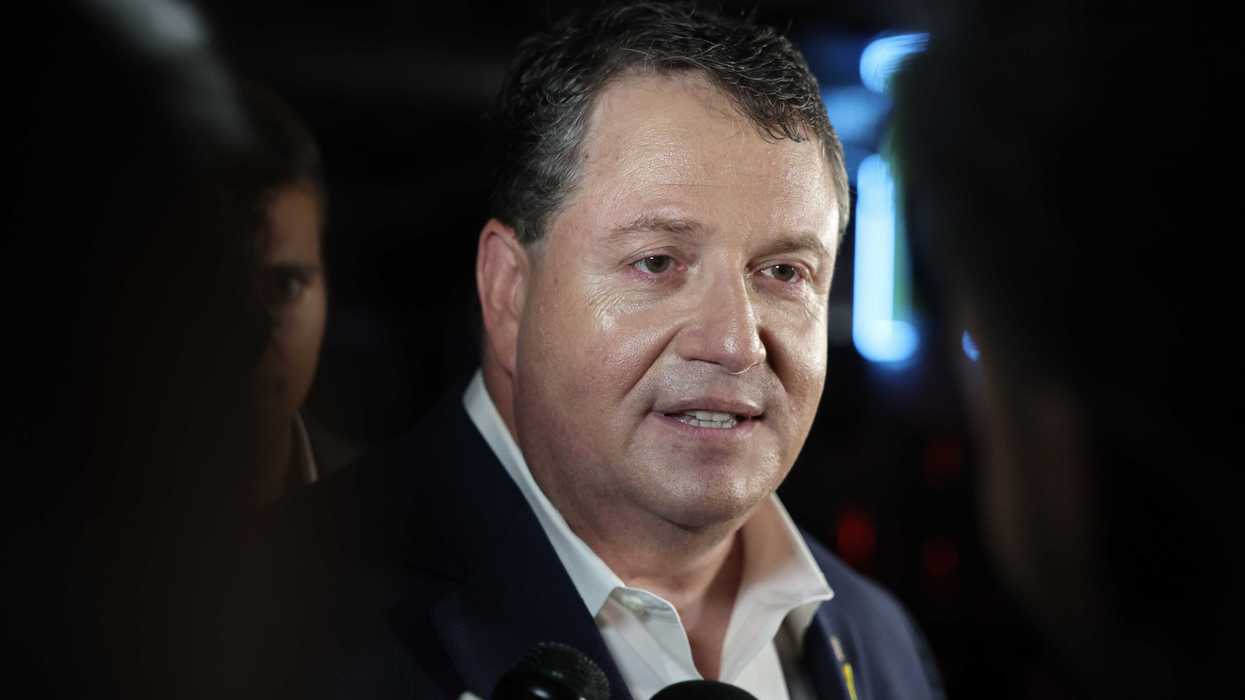 Randy Fine, a white man with short black hair, speaking to reporters.