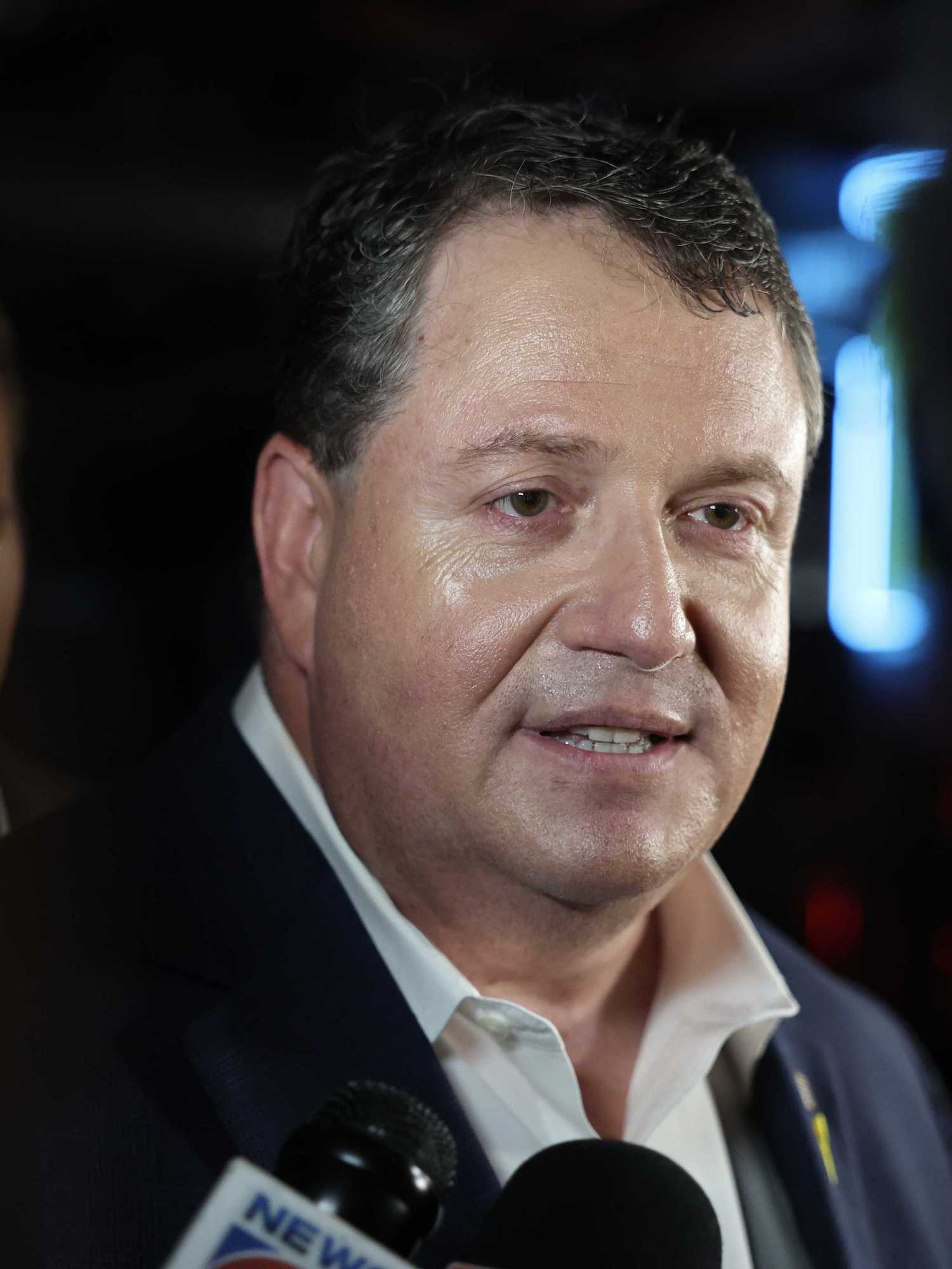 Randy Fine, a white man with short black hair, speaking to reporters.