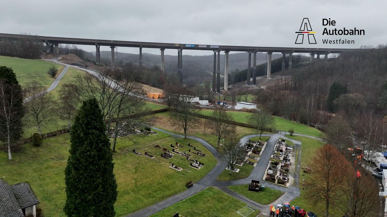 Dramatic moment 70 foot-high bridge comes crashing down as it's demolished with 120kg of explosives