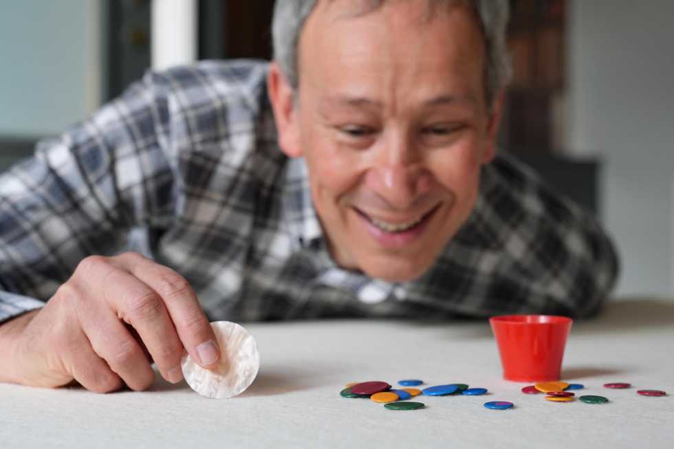 Can he flick it? Yes he can – professor sees off tiddlywinks title challenger