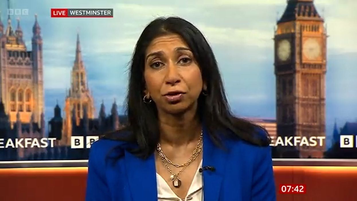 Suella Braverman criticised for photo of her laughing on roof of Rwanda building