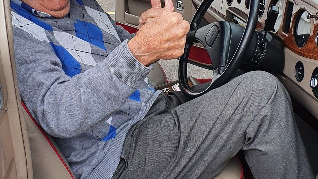 Resident Alec Goy enjoys the Rolls Royce visit at Care UK’s Weald Heights (Care UK’s Weald Heights/PA).