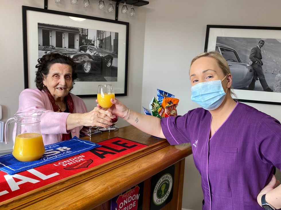 Resident Rocchina Morris and staff member Chloe Reilly at Linwood care home in Thames Ditton (Anchor/PA)