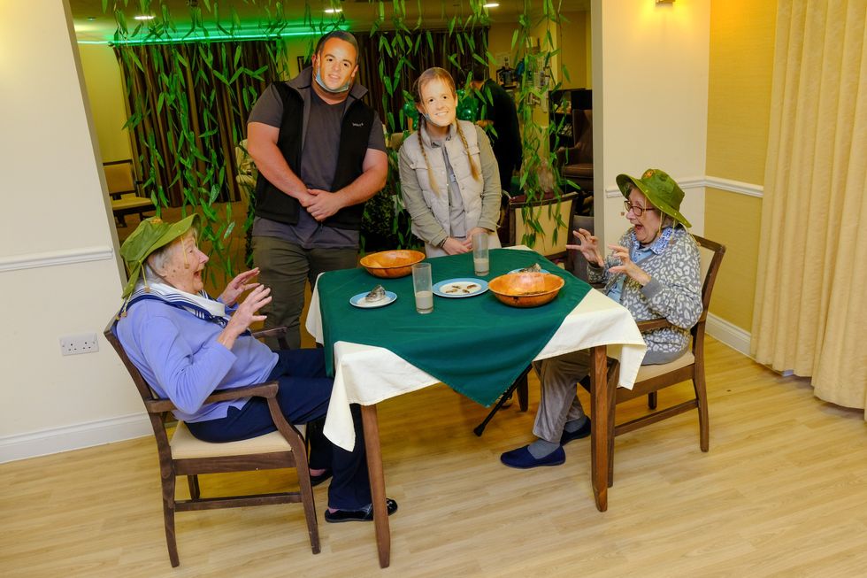 Residents Doreen Barber, 96, and Mary Tierney, 92, take part in a bushtucker trial at Care UK\u2019s Mountfitchet House care home (Care UK/PA)
