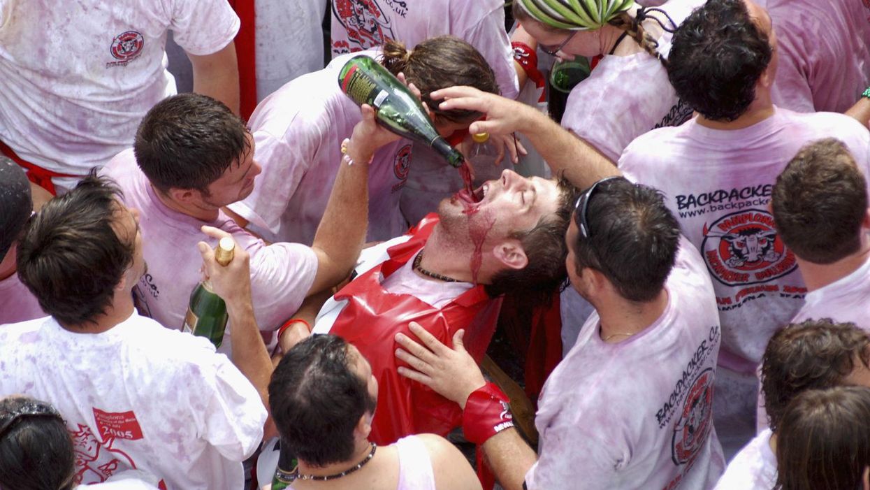 Revellers celebrate the 'Chupinazo' at the beginning of the San Fermin Festival in Pamplona, Spain