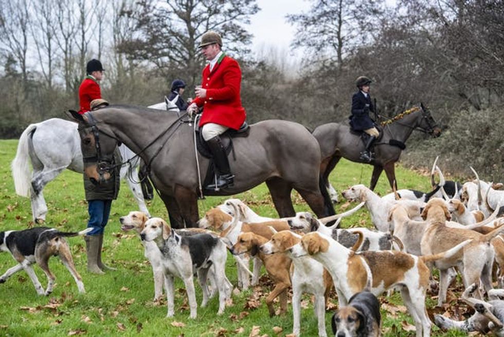 Riders and hounds during the Tedworth Hunt\u2019s Boxing Day meet in Pewsey, Wiltshire