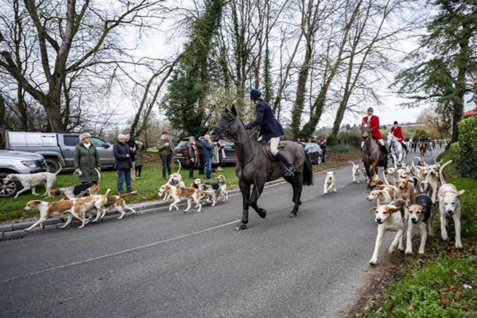 Riders and hounds during the Tedworth Hunt\u2019s Boxing Day meet in Pewsey, Wiltshire