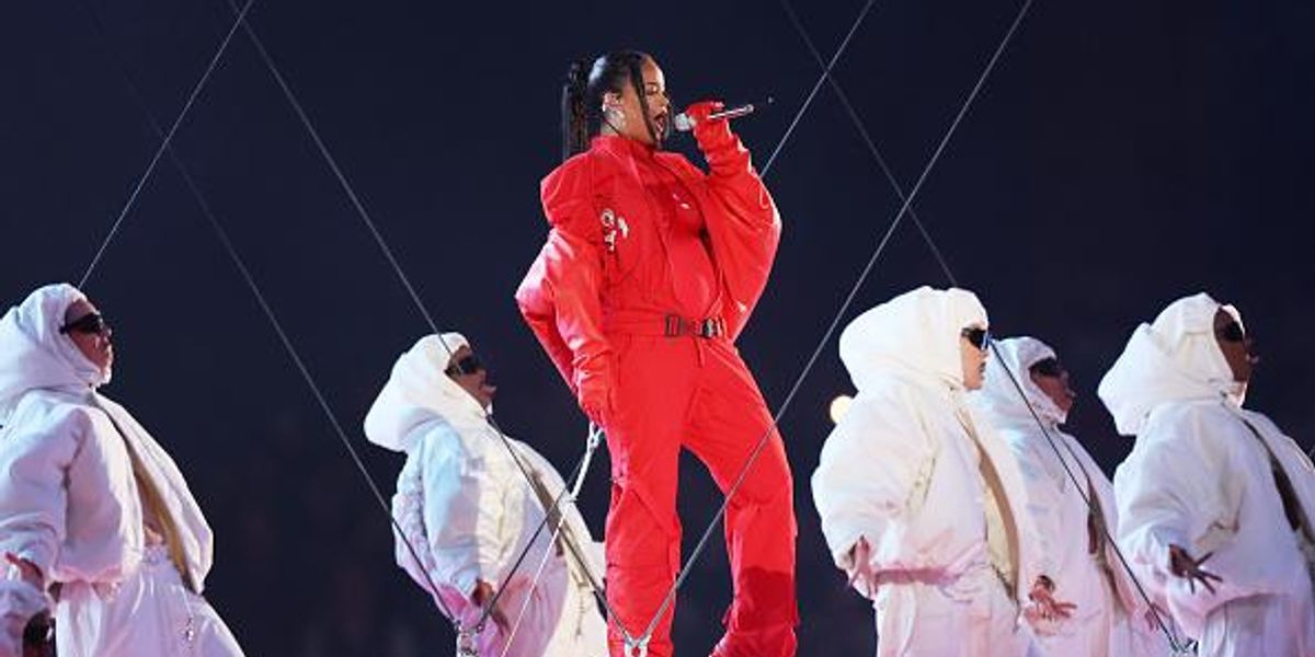 Rihanna Shows Off Her Pregnant Belly In A Monochromatic Red