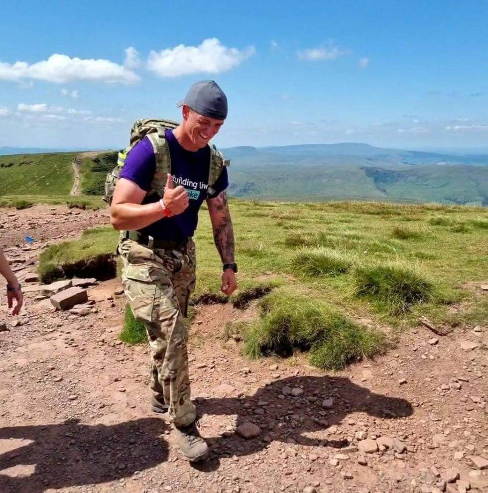 Soldier with PTSD carries rowing machine up mountain in world record attempt