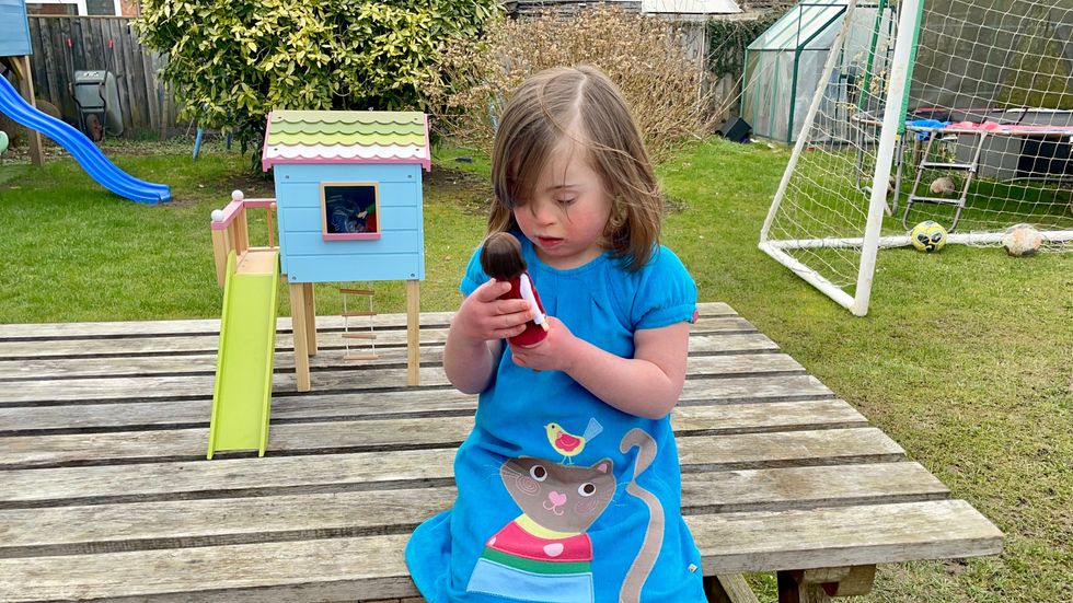 Rosie Barnett, 6, with a new Lottie Dolls toy that is inspired by her