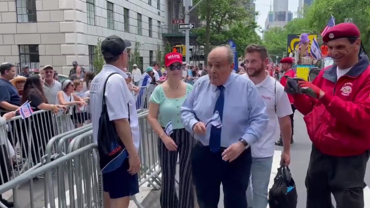 Rudy Giuliani yells at heckler on the street calling them a 'jacka**' and 'brainwashed a**hole'