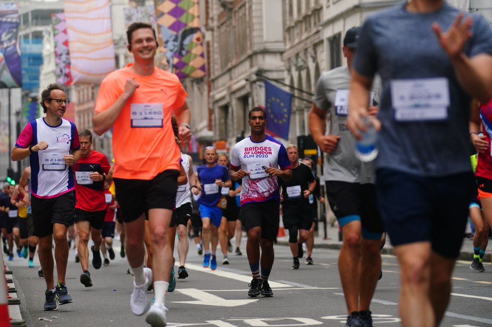 Runners in Piccadilly taking part in the Asics London 10k (Victoria Jones/PA)