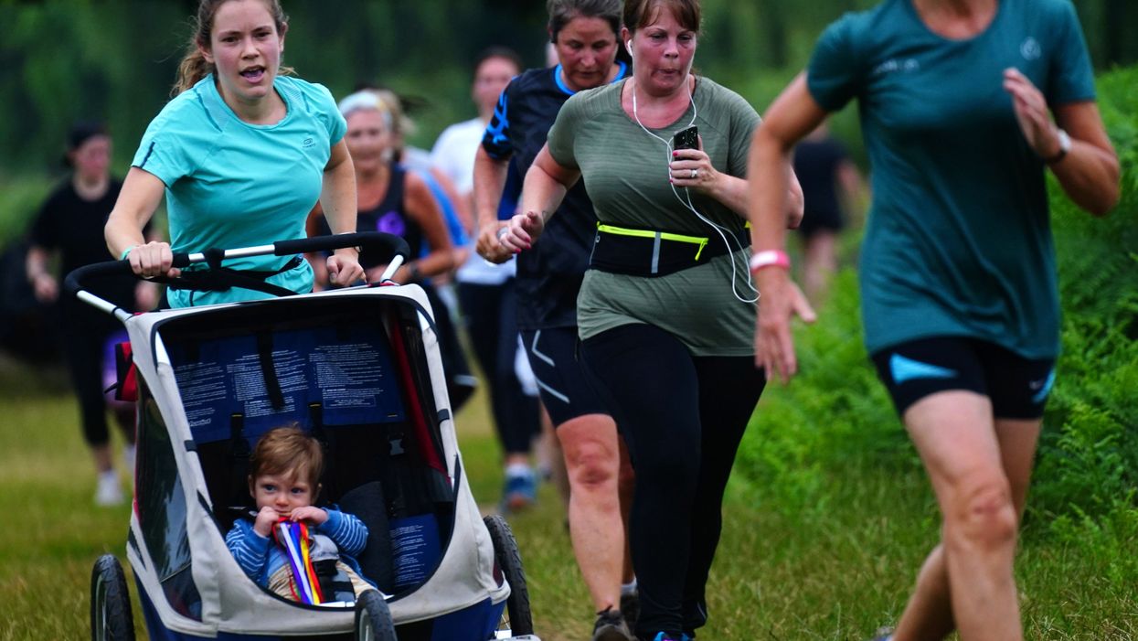 <p>Runners taking part in the Parkrun at Bushy Park, London, the largest and oldest Parkrun in the UK</p>
