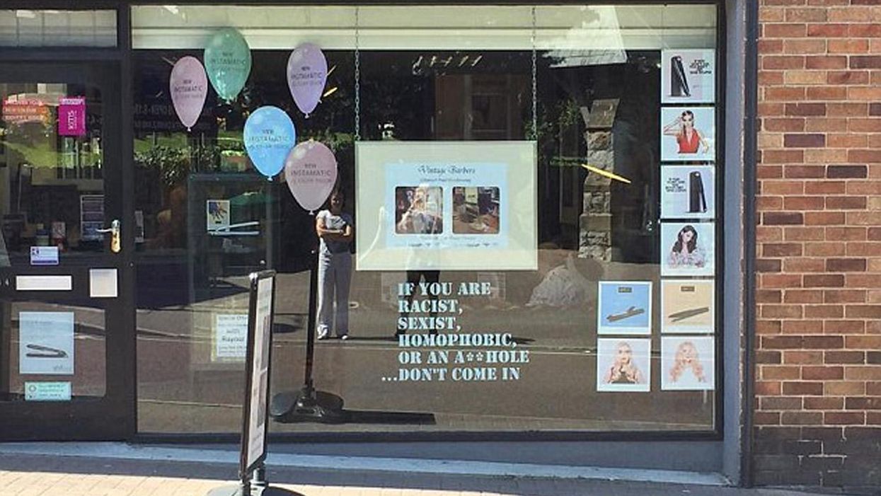 Russell Hughes, who owns Russell Paul Hairdressing in Prestatyn, put a sign in his salon window on Tuesday which reads: If you are racist, sexist, homophobic or an a***hole... don’t come in