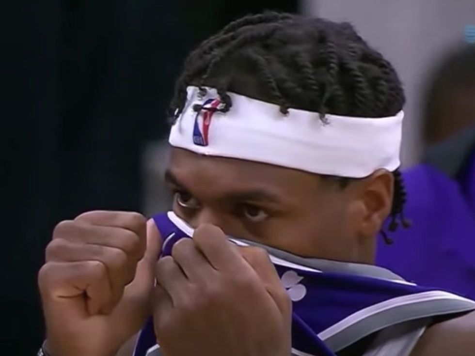 Sacramento Kings Buddy Hield covering his nose