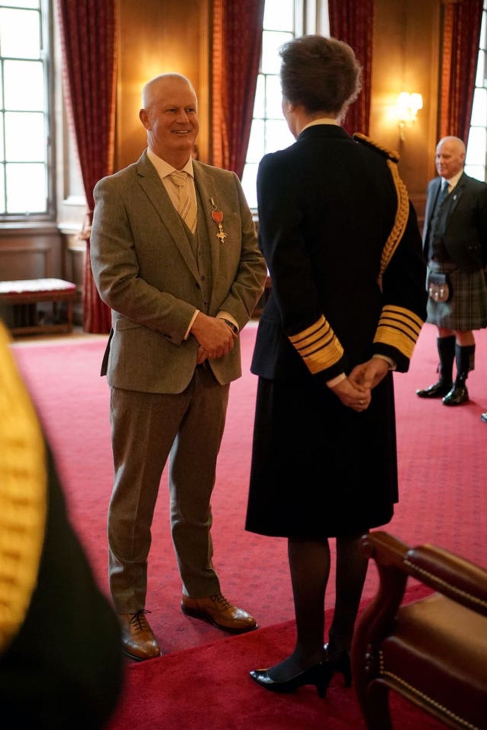 Sandy Lyle talking to the Princess Royal at the investiture ceremony in Edinburgh