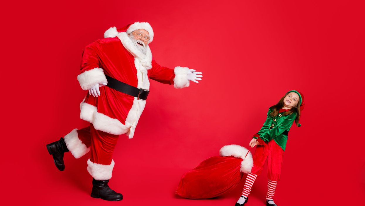 <p>Santa chasing an elf with a bag of toys</p>