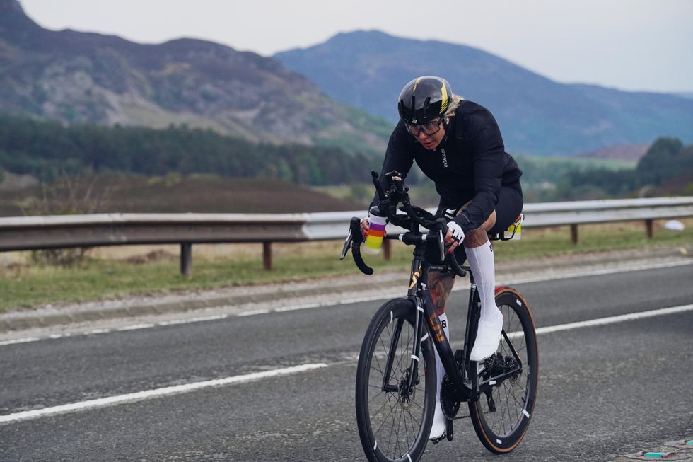 Sarah Ruggins cycling on a road