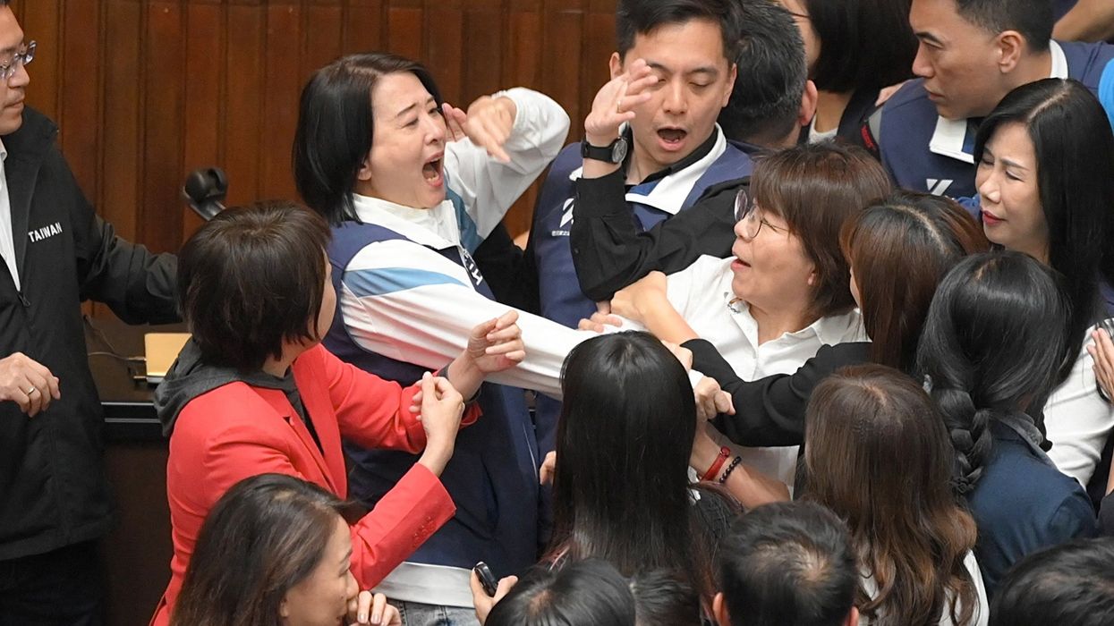 Taiwan legislator runs off with bill so it can't be passed during mass Parliament brawl
