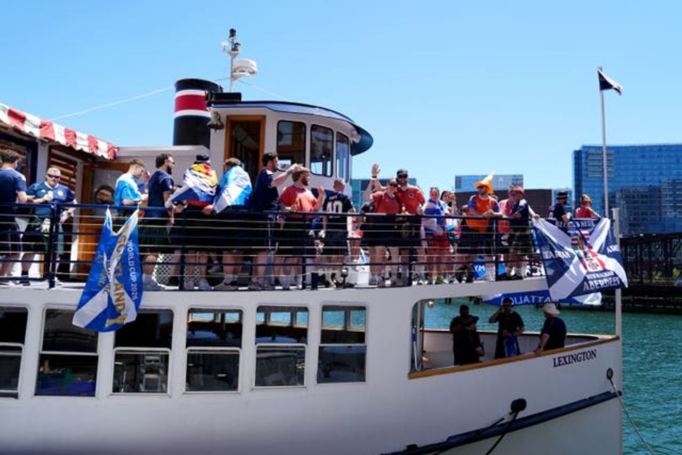 Scotland fans on a boat