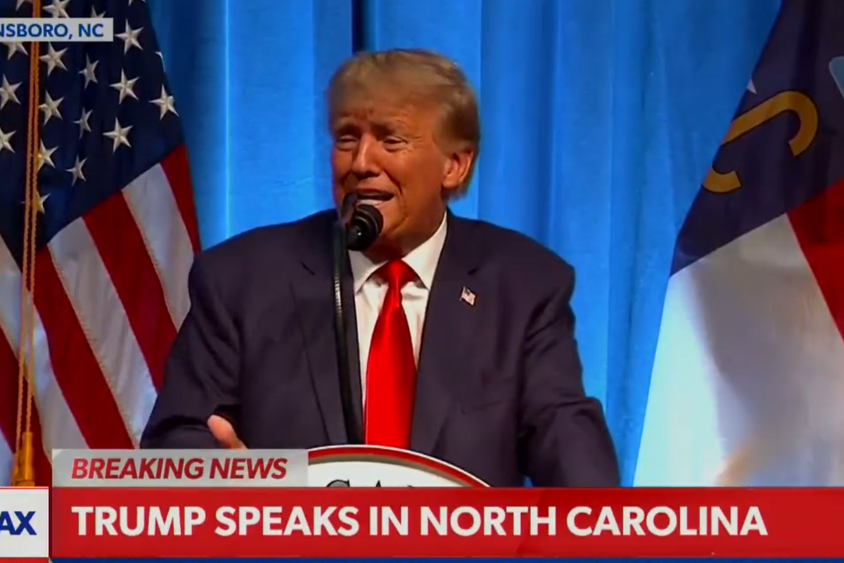 Screenshot of a Newsmax broadcast showing Donald Trump speaking in front of two US flags. The chyron at the bottom reads: 'Trump speaks in North Carolina'.