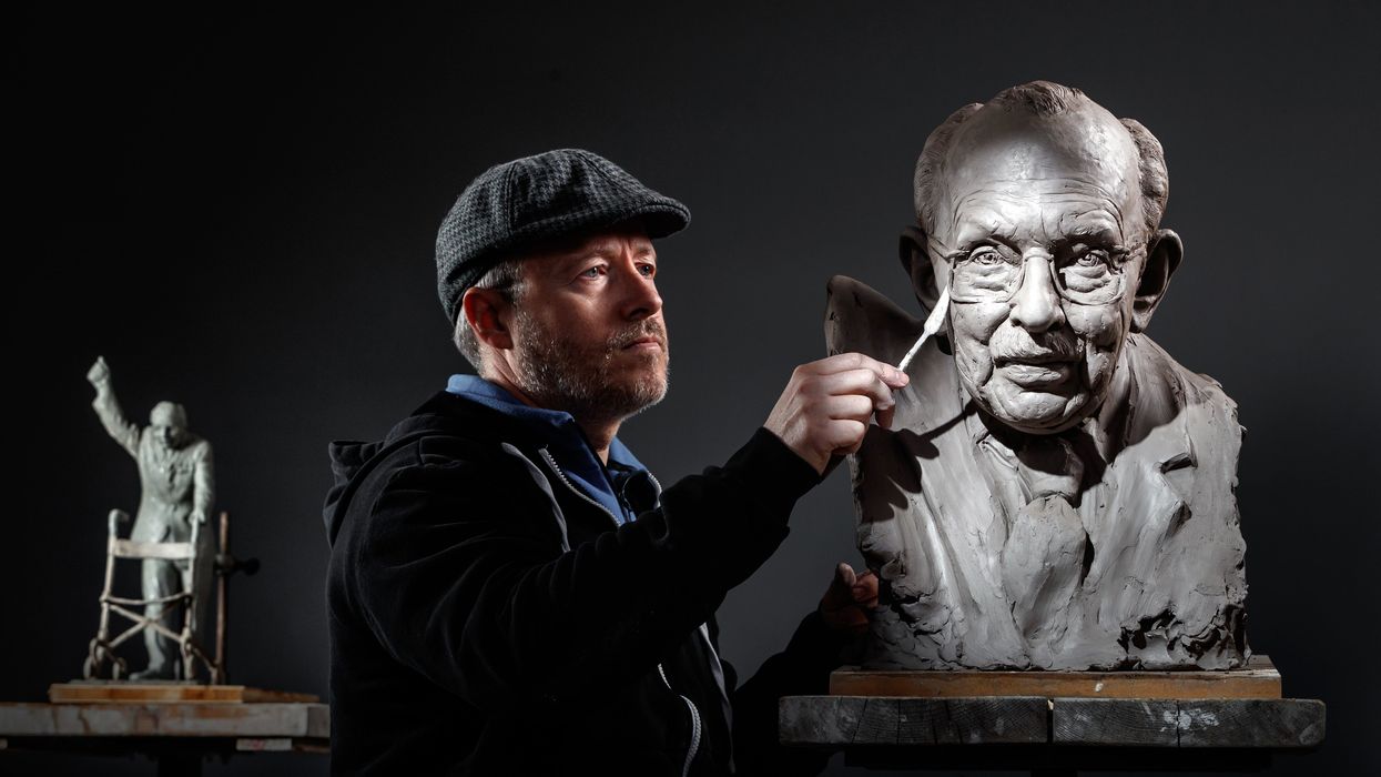 Sculptor Andrian Melka at his studio in York, working on a clay portrait of Captain Sir Tom Moore