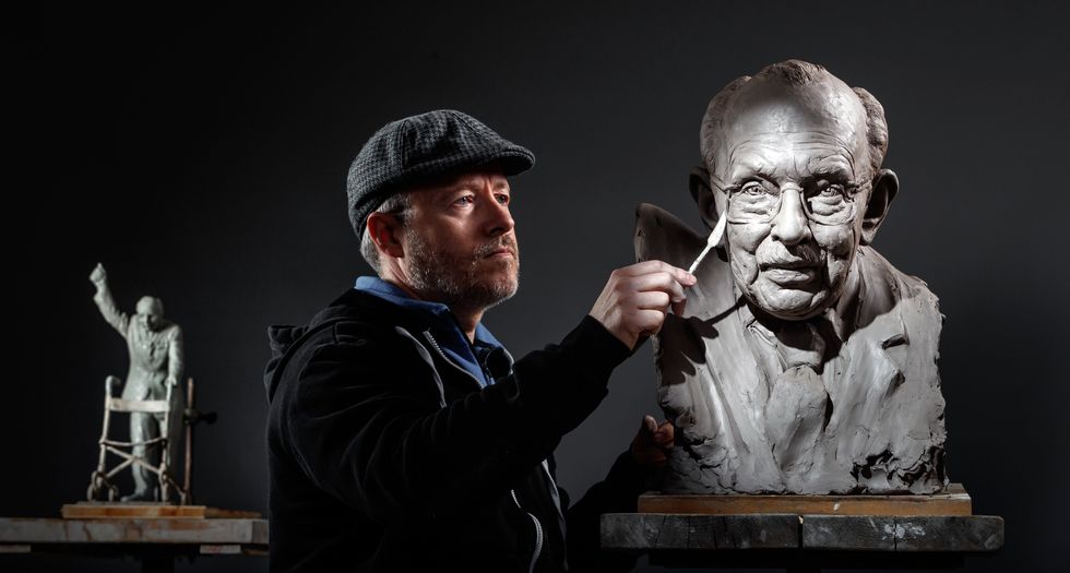 Sculptor Andrian Melka at his studio in York, working on a clay portrait of Captain Sir Tom Moore