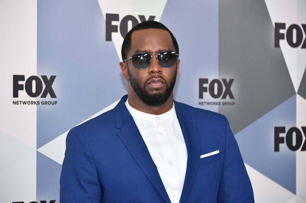 Sean "Diddy" Combs wearing sunglasses and a blue suit jacket