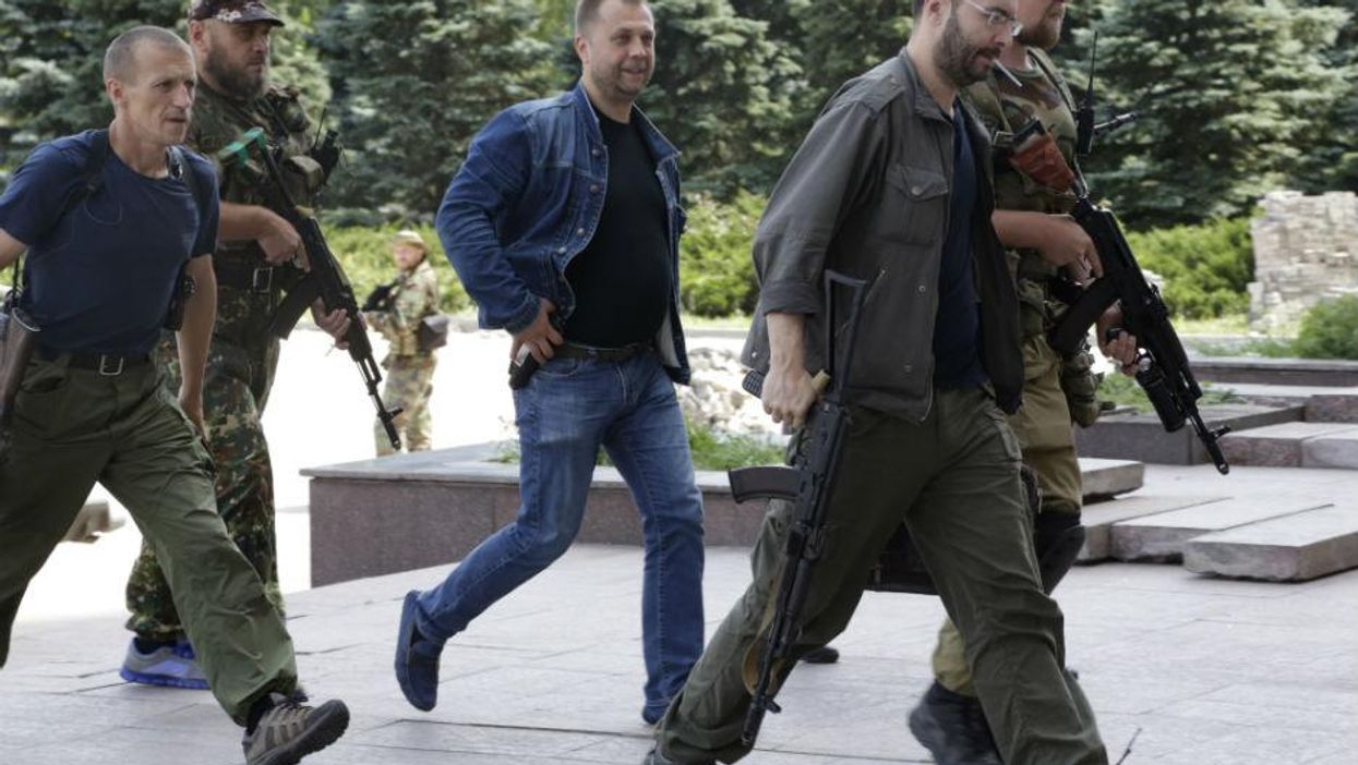 Self-declared leader of the Donetsk People's Republic, Aleksandr Borodai, centre