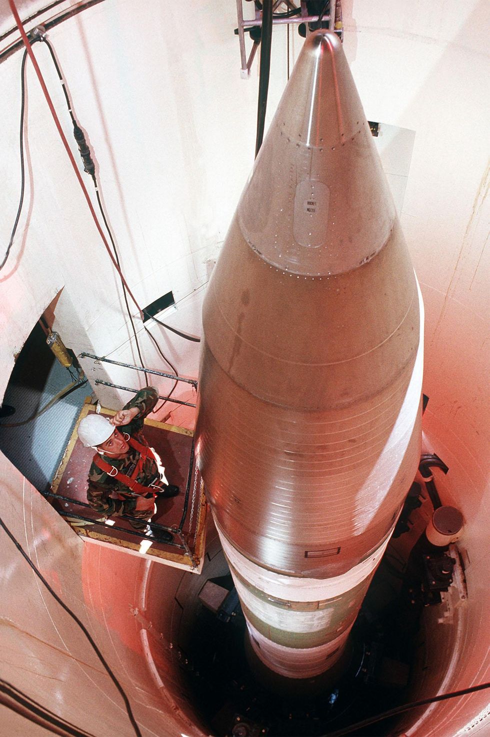 Sgt. Stephen M. Kravitsky inspects an LGM-30G Minuteman III missile inside a silo about 60 miles from Grand Forks Air Force Base, N.D. Kravitsky, a missile systems analyst with the 321st Organizational Missile Maintenance Squadron, has been named as one of the Outstanding Airmen of the Year for 1989.