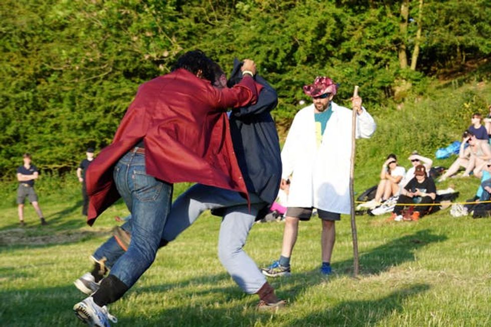 Shin-kickers watched by a stickler referee